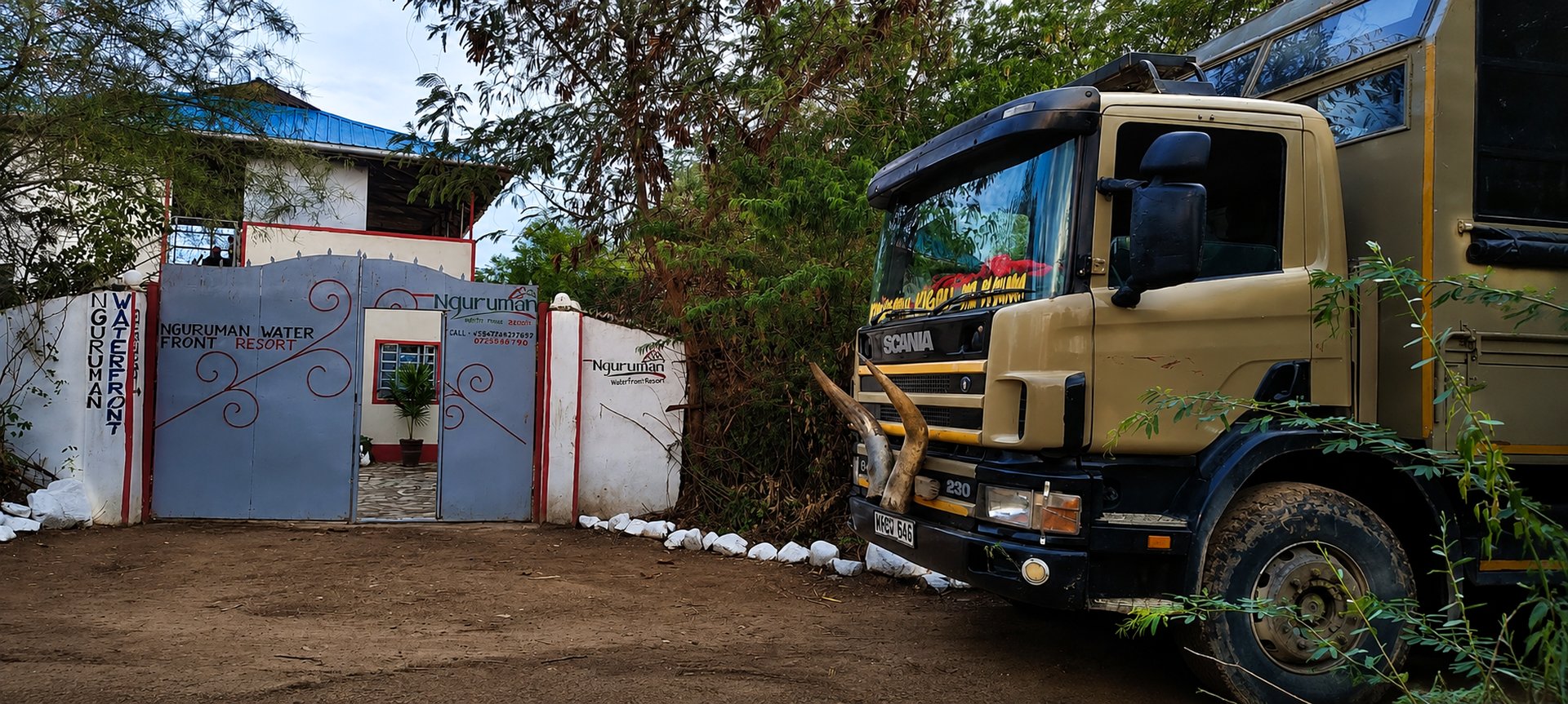 The Nguruman Waterfront Resort gate with a truck parked outside