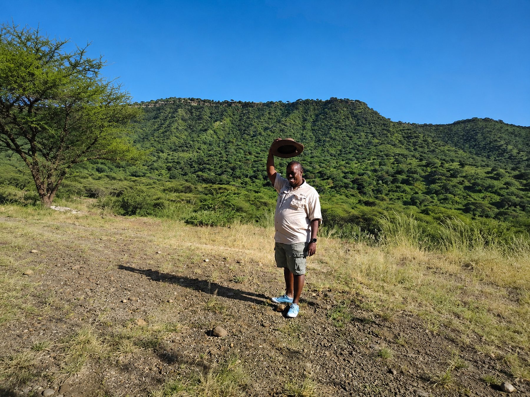Leonard, host at Nguruman Waterfront Resort, with the escarpment behind him