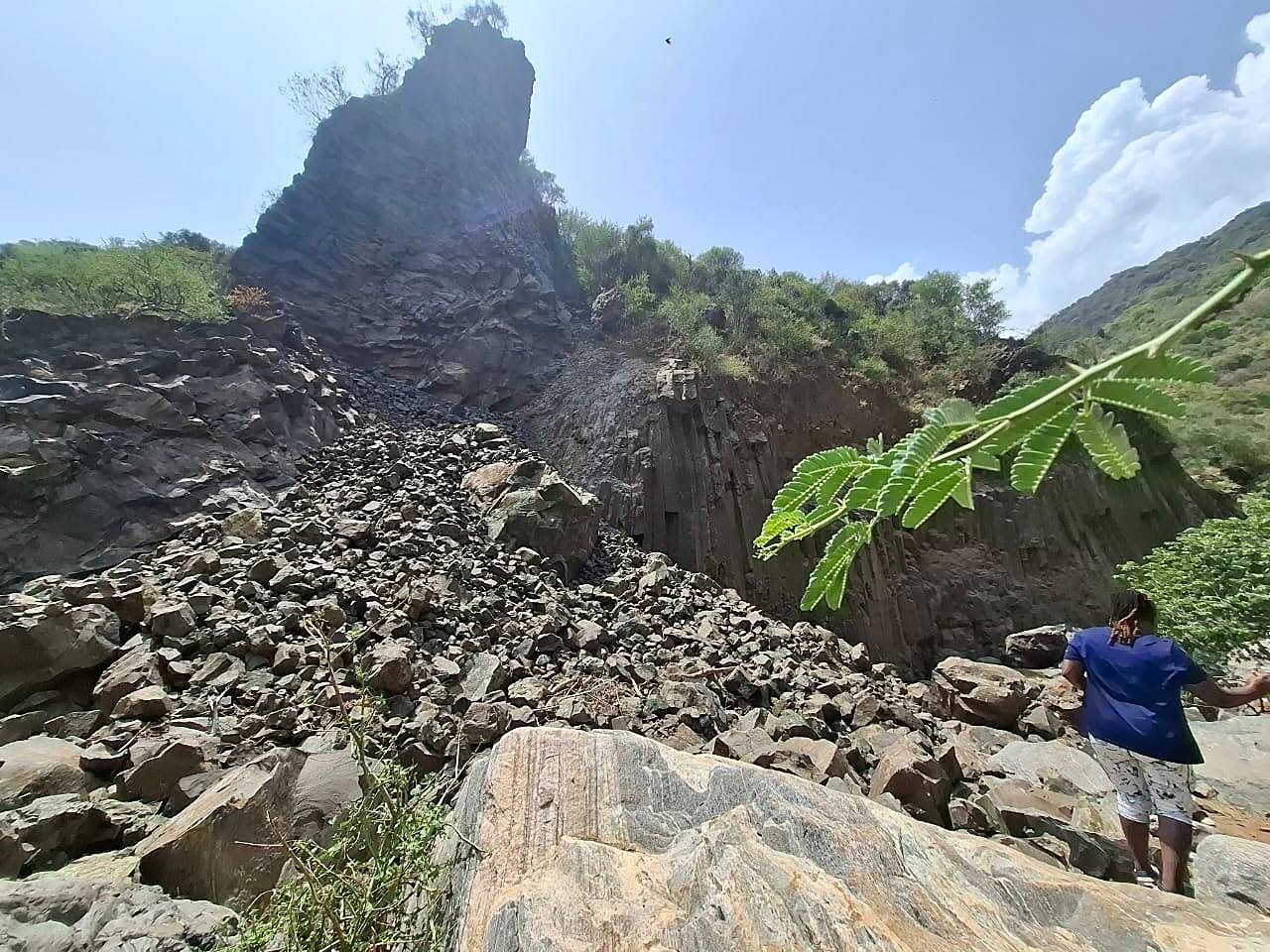 Exposed rock face and scree at the head of a canyon on the escarpment